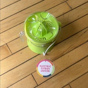 Vibrant Green Citrus Juicer for Party Drinks